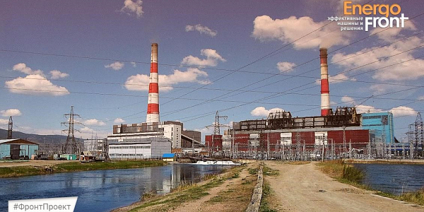 ТЭС у канала: две полосатые трубы, корпуса и линии электропередач